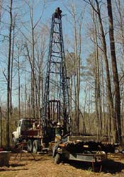 Photograph of drill and truck with tower raised