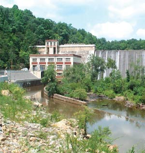 Photograph of the operating house and dam on Lake Michie.